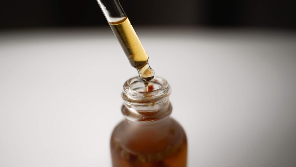 a bottle filled with liquid and a pipe sticking out of it